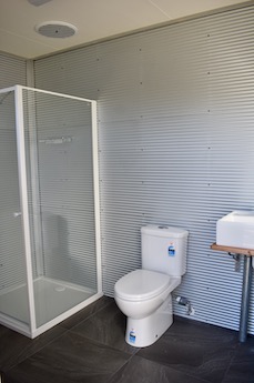 Interior of private ensuite bathroom for powered caravan site at Lilydale Pine Hill