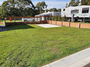 Grassed powered caravan site with concrete slab, water and sullage in Lilydale